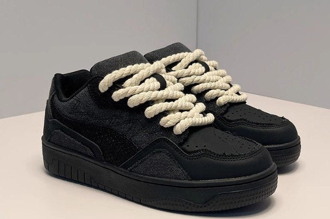 Black Low-Top Sneakers With White Rope Laces